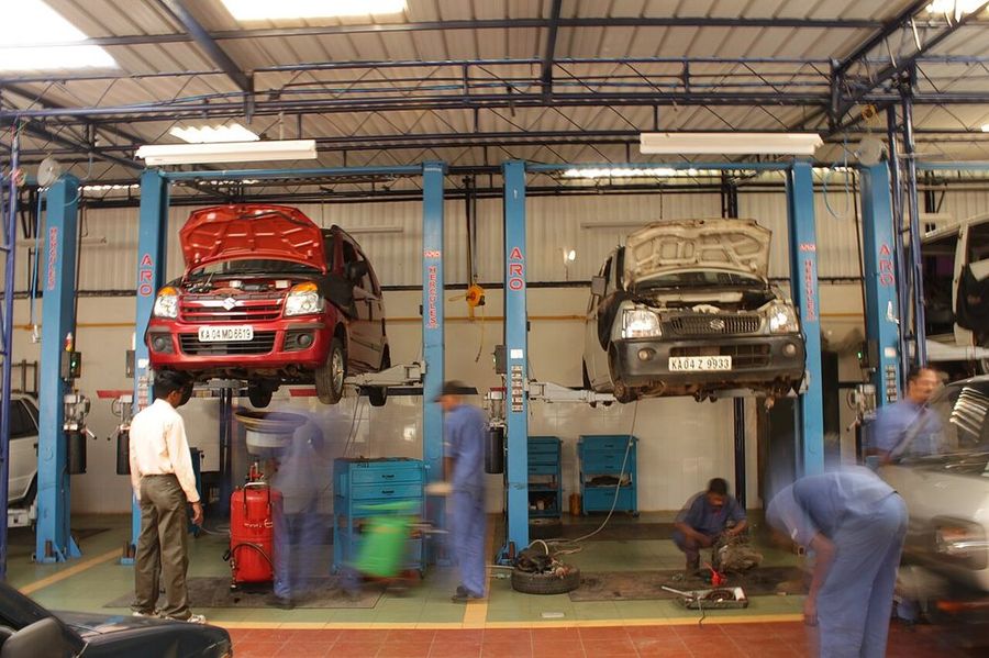 Shop bays with vehicles on lifts