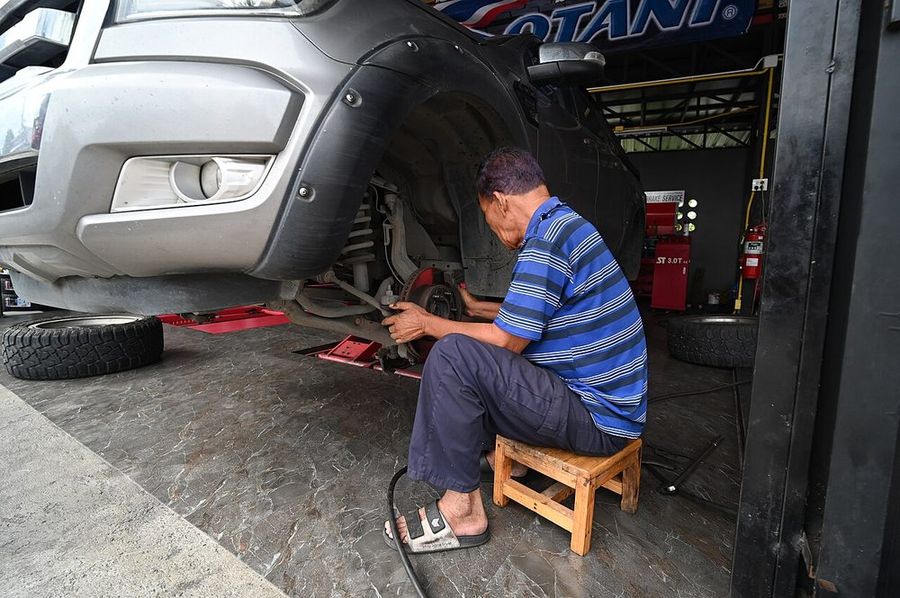 Technician working on a front end